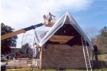 covering_roof_with_plastic